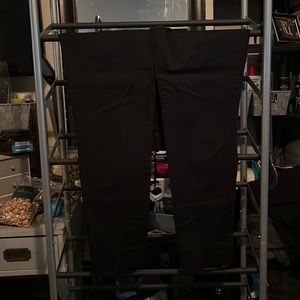 Woman’s shin high black business attire pants